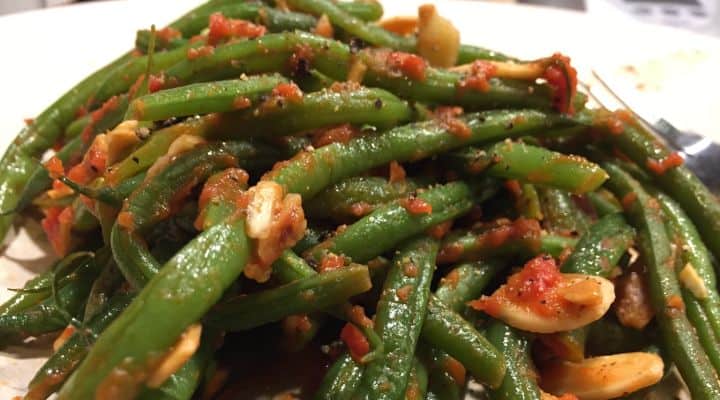 Photo of a heaping plate of our Paleo SCD green beans recipe. Green bean recipes for paleo dieters can be plain at times. This recipe puts together a delicious assembly of flavors and textures. Unlike other string beans paleo recipes, the almonds in this recipe are toasted, giving a delicious rich and smokey flavor.