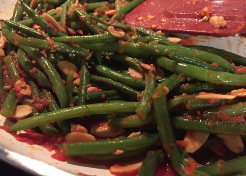 The green bean paleo recipe shown cooking here in the skillet. This is a great option to include as one of your Paleo side dish recipes. These Paleo diet green beans are kind of reminiscent of Greek green beans in tomato sauce or Italian green beans in tomato sauce.