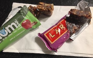 Photo of unwrapped freedom bar next to an unwrapped Lara bar