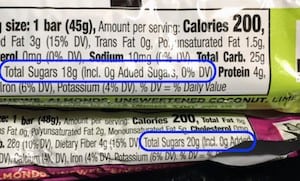 Photo of 2 whole30 compliant larabar flavors - highlights the sugar content in each of these lara bars: apple cinnamon and cherry pie. We often see the question posed: what larabars are whole30 compliant - in this article we go over bars that are both paleo compliant and whole30 compliant from both Larabar and Freedom Bar. 