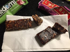 Photo comparison of an unwrapped larabar cross section compared to a freedom bar cross section - We answer the question "are Larabars organic?" and go over which organic larabars are also Whole30 and Paleo friendly